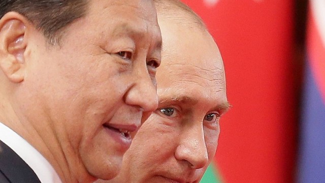 ITAR TASS SHANGHAI CHINA MAY 21 2014 China s president Xi Jinping L and Russia s president Vl